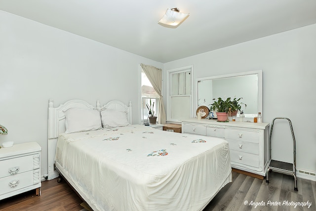 bedroom featuring dark wood-type flooring