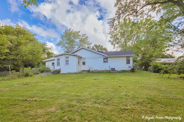 back of house featuring a yard