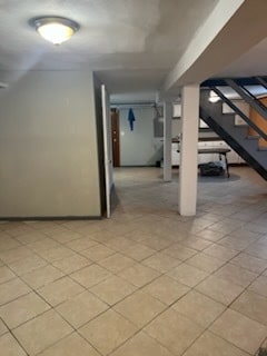 basement with light tile patterned floors