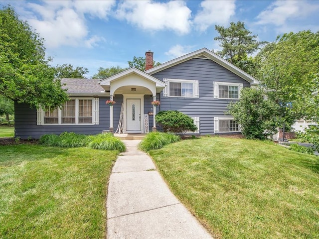 tri-level home featuring a front yard