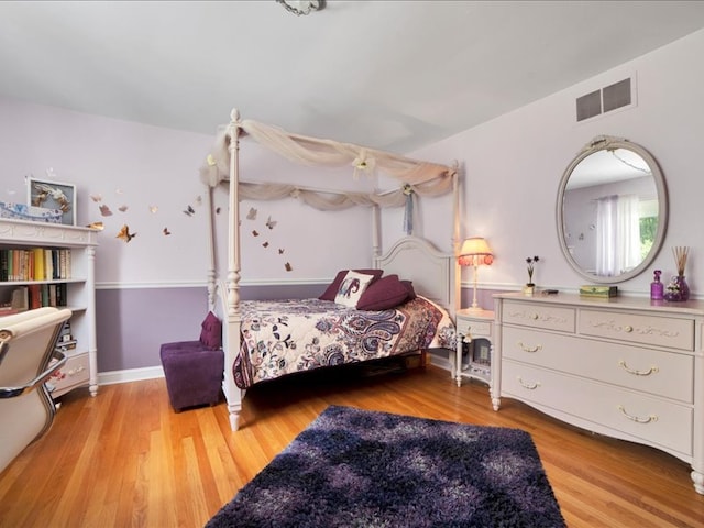 bedroom with light hardwood / wood-style floors