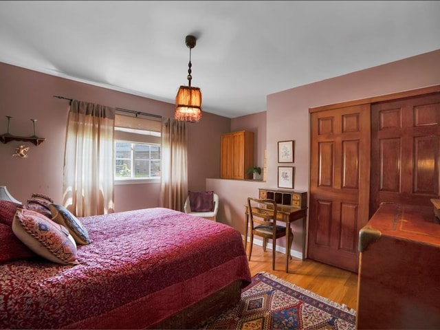 bedroom featuring light wood-type flooring