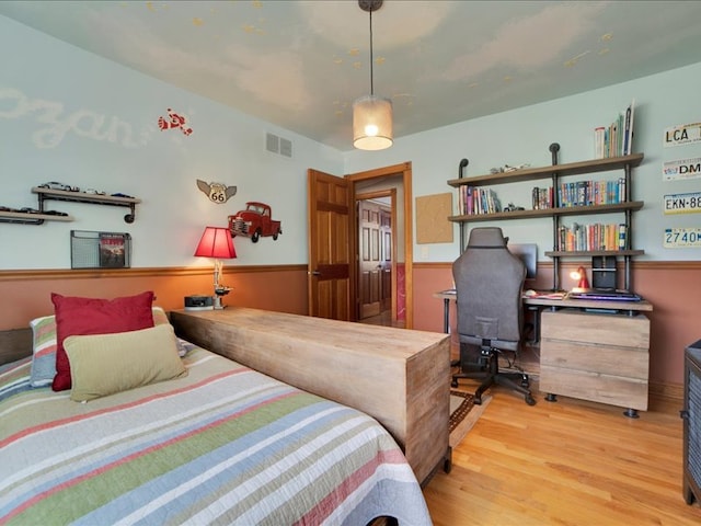 bedroom with light hardwood / wood-style flooring