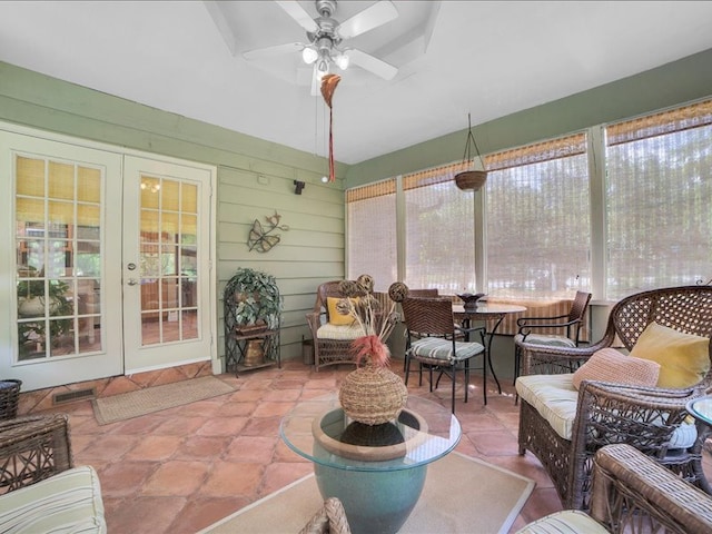 sunroom / solarium featuring ceiling fan and french doors