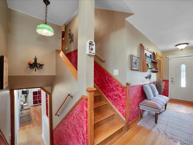 stairs featuring wood-type flooring