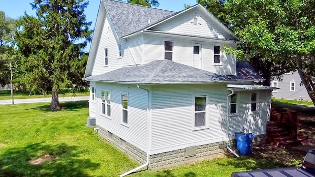 view of home's exterior featuring a yard