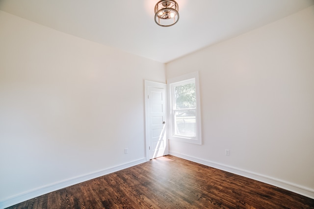 unfurnished room featuring hardwood / wood-style flooring