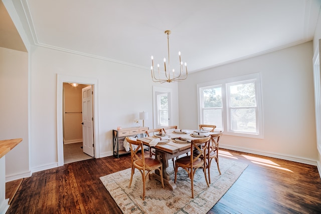 dining room with a notable chandelier, ornamental molding, and wood-type flooring