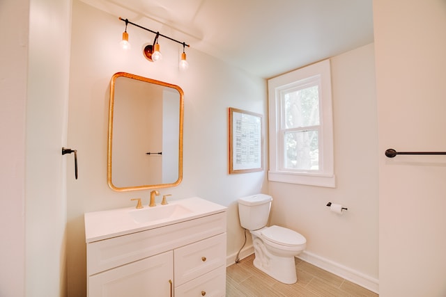 bathroom with tile patterned floors, toilet, and vanity