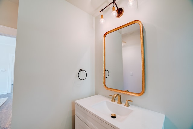 bathroom with vanity and hardwood / wood-style floors