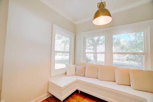 living room with crown molding and hardwood / wood-style floors