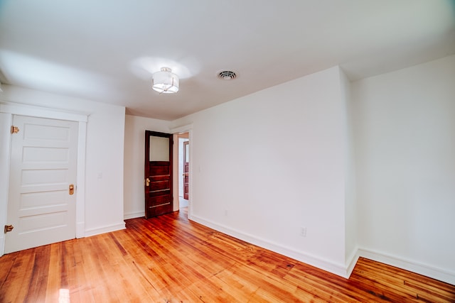 empty room featuring wood-type flooring