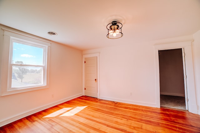 spare room featuring light hardwood / wood-style flooring