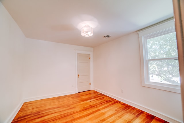 empty room featuring hardwood / wood-style floors