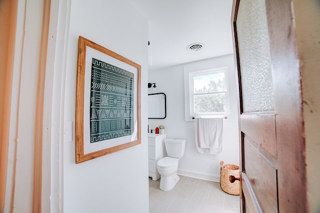 bathroom featuring tile patterned flooring and toilet