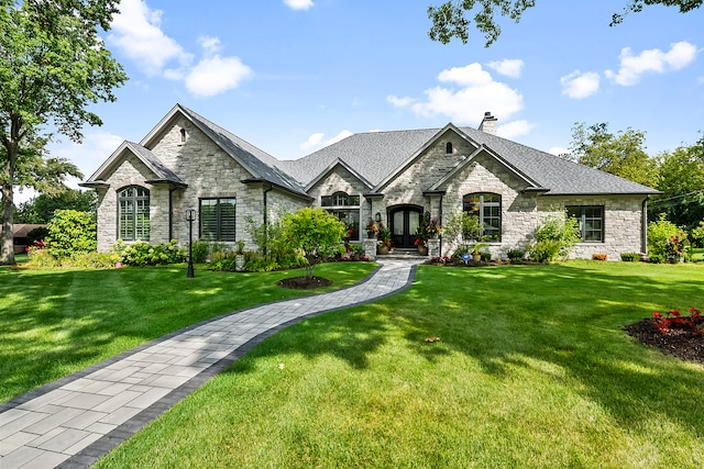 french provincial home with a front lawn