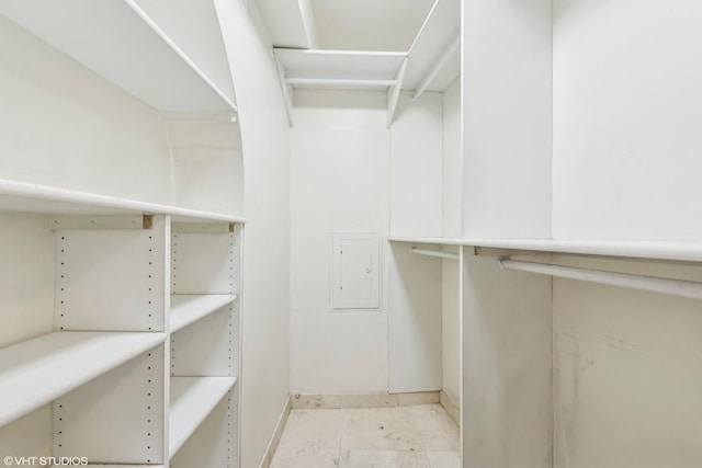 walk in closet featuring electric panel