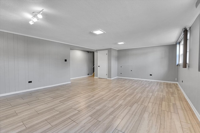 basement featuring a textured ceiling