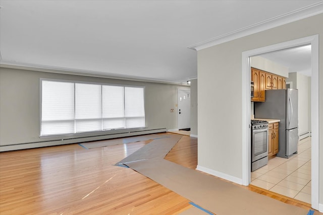 interior space with a baseboard radiator, crown molding, and light hardwood / wood-style flooring