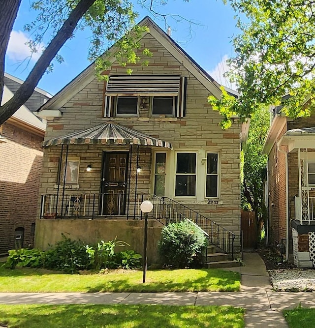 view of front of property featuring stone siding