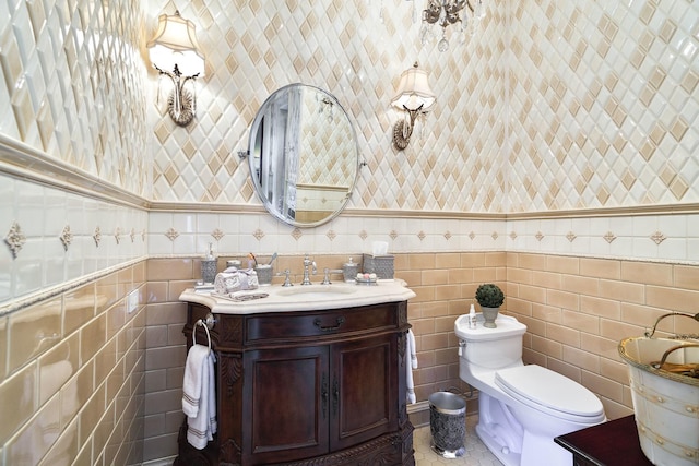 bathroom with vanity, toilet, and tile patterned floors