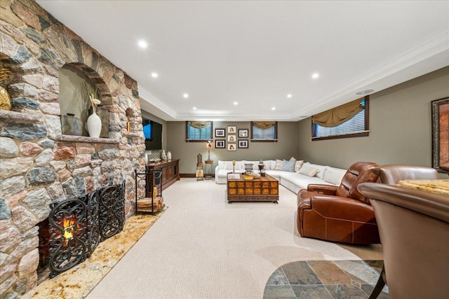 carpeted living room featuring ornamental molding, recessed lighting, a fireplace, and baseboards