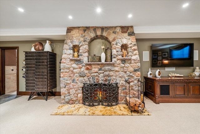 carpeted living room with a fireplace, ornamental molding, and recessed lighting