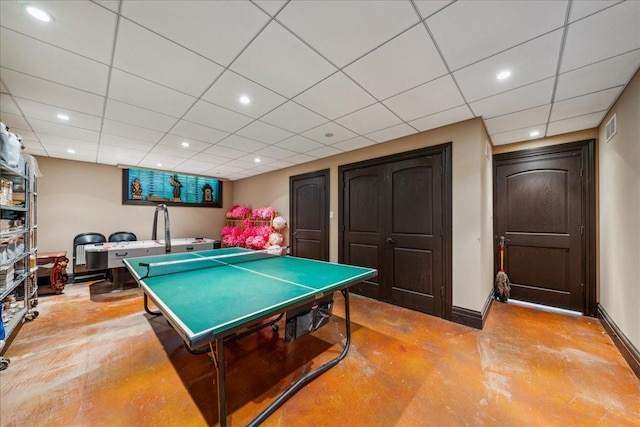 recreation room featuring baseboards, recessed lighting, visible vents, and finished concrete floors