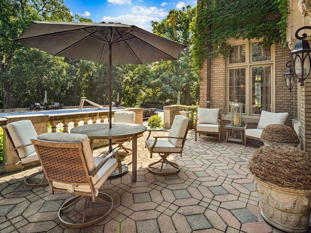 view of patio / terrace with a pool