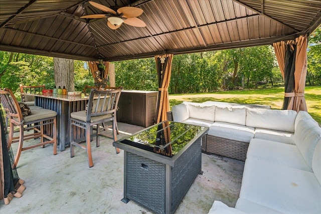 view of patio featuring an outdoor hangout area, a gazebo, and ceiling fan