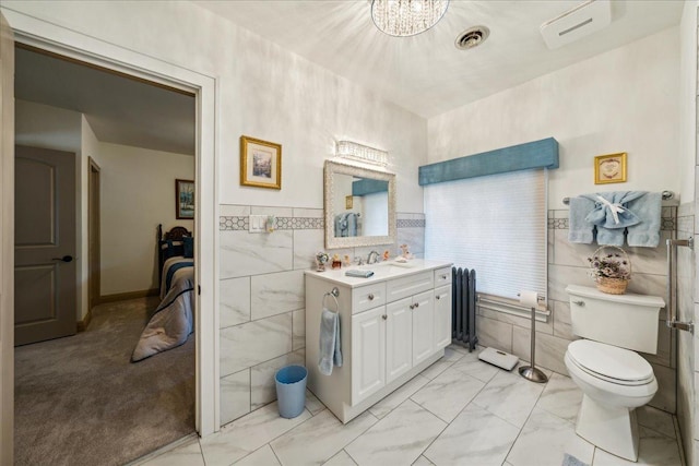 bathroom with vanity, visible vents, tile walls, marble finish floor, and a wall mounted AC