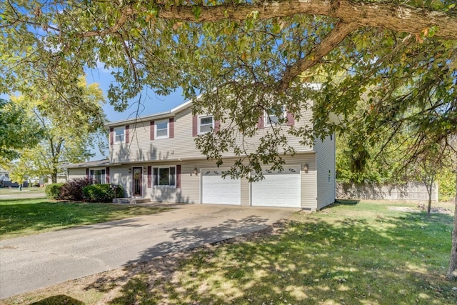 view of front of property featuring a front yard and a garage