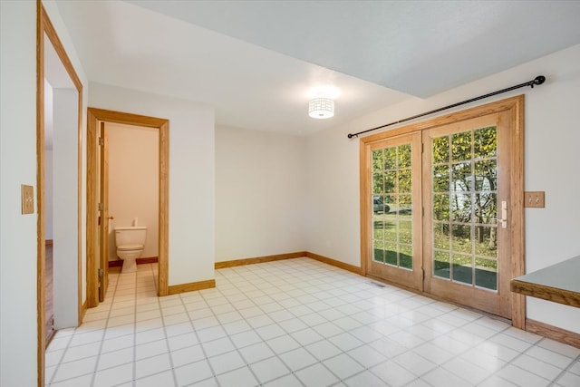 spare room featuring light tile patterned floors