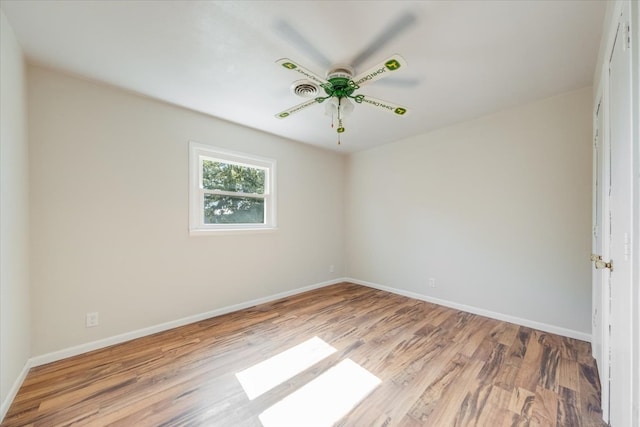 empty room with ceiling fan and light hardwood / wood-style floors