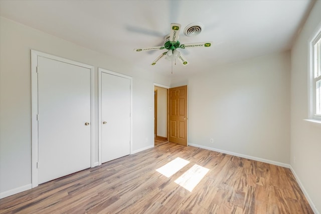 unfurnished bedroom featuring light hardwood / wood-style floors and ceiling fan