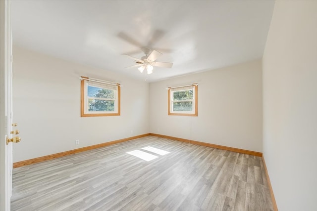 unfurnished room featuring light hardwood / wood-style floors and ceiling fan