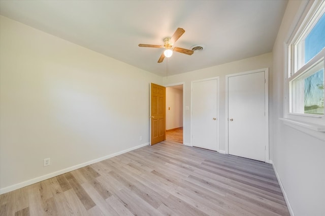 unfurnished bedroom featuring ceiling fan and light hardwood / wood-style floors