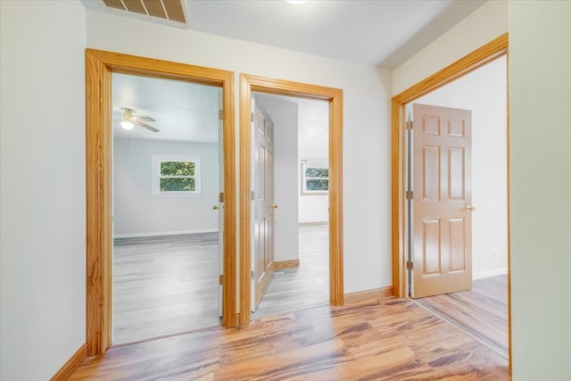 hallway with light wood-type flooring