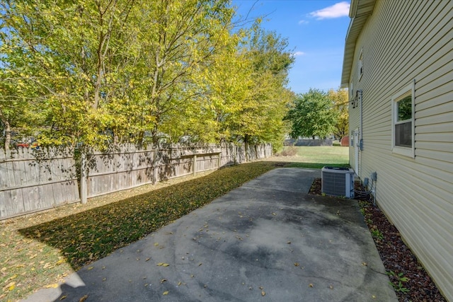 view of yard featuring a patio and central AC