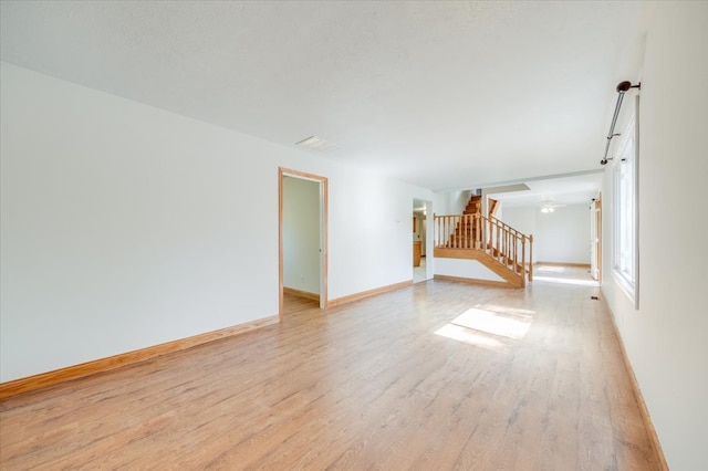 spare room with light hardwood / wood-style floors