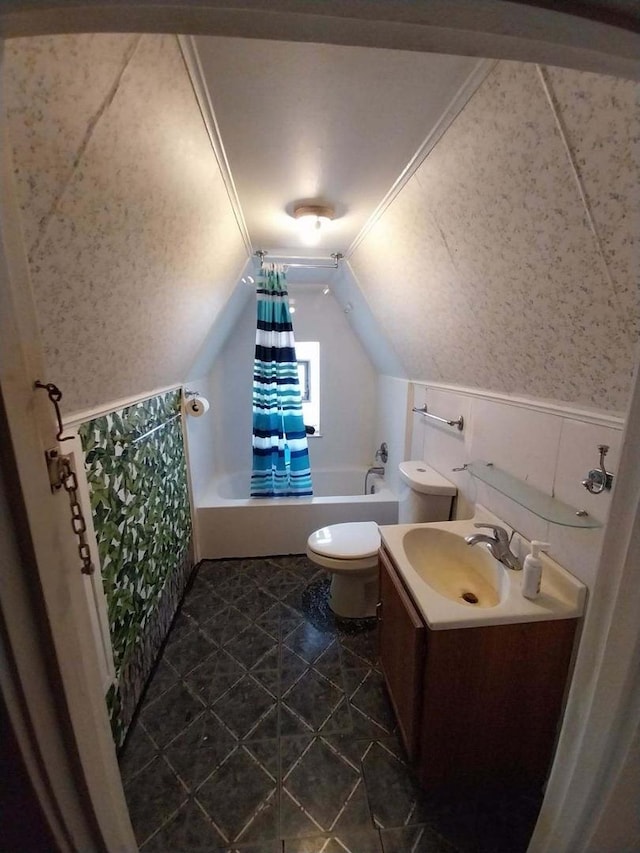 full bath with toilet, shower / bath combo, vaulted ceiling, vanity, and tile patterned floors