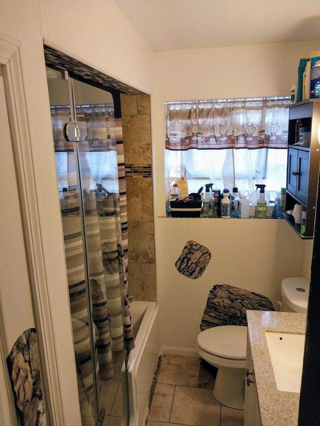 full bathroom with tile patterned flooring, shower / bath combo with shower curtain, vanity, and toilet