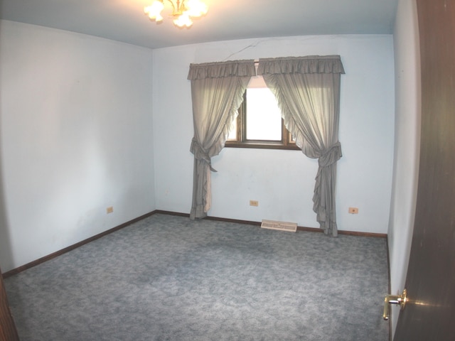 empty room featuring carpet floors