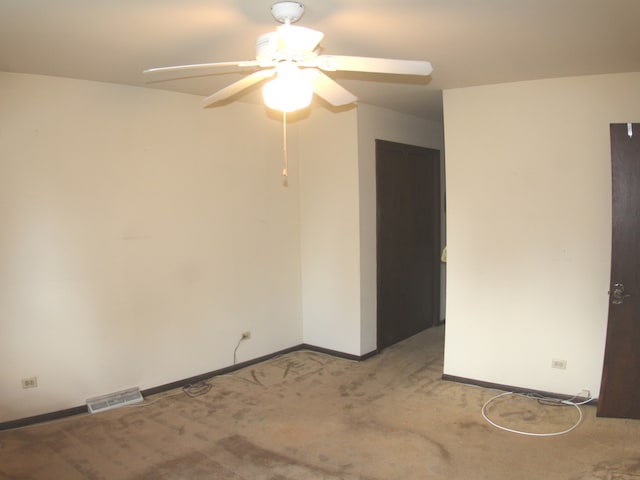 carpeted empty room with ceiling fan