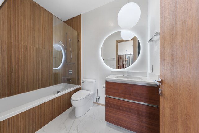 full bathroom featuring toilet, vanity, tiled shower / bath, and tile patterned floors