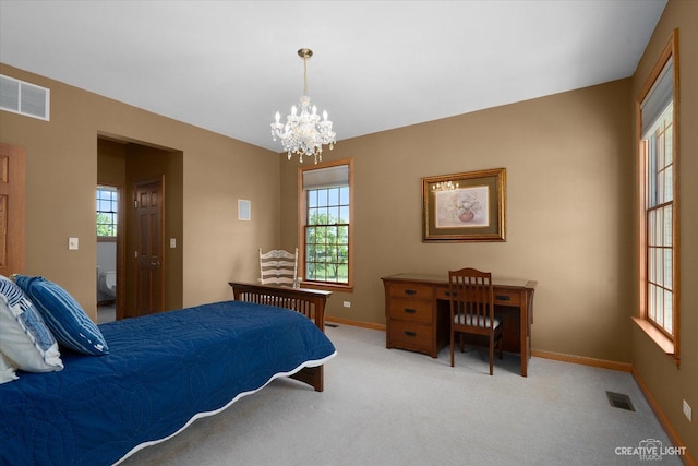 bedroom featuring a chandelier and carpet flooring