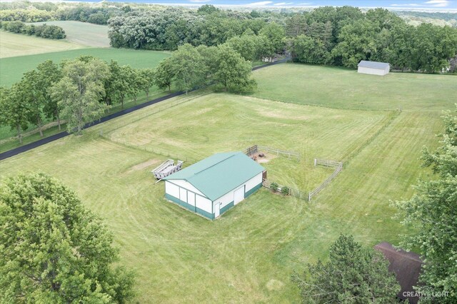 birds eye view of property with a rural view