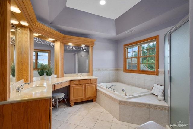 bathroom featuring tile patterned floors, separate shower and tub, vanity, and a healthy amount of sunlight