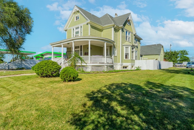 view of front of house featuring a front yard and covered porch