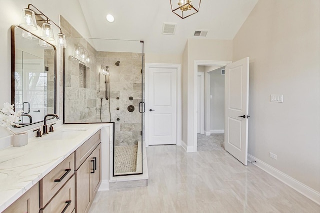 full bath featuring a shower stall, visible vents, baseboards, and vanity